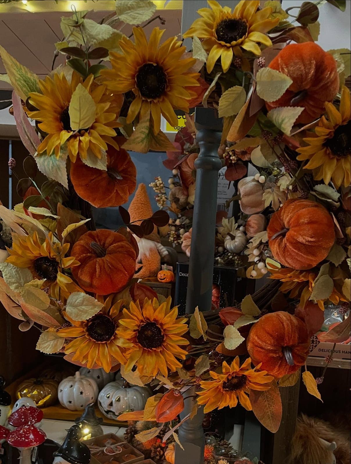 An autumn display of sunflowers and pumpkins